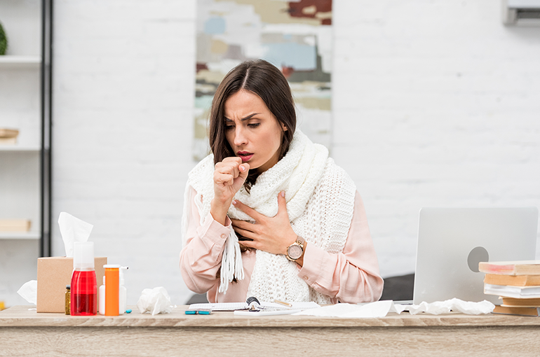 an image of a young woman not feeling physically well